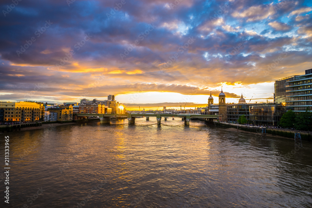 Thames river at sunset overlooking Southwark bridge in London