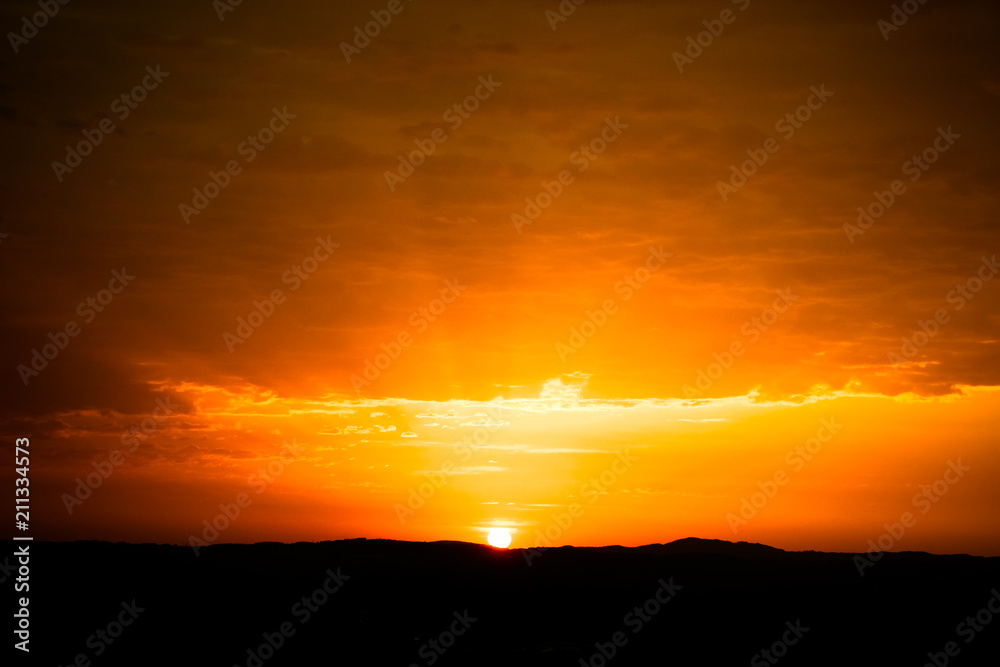 orange colored sky at sunrise