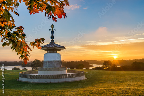 Peace Pagoda temple at sunrise in Willen Park, Milton Keynes, UK photo