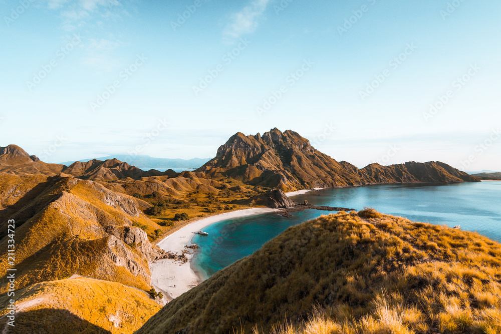 Top view of Padar Island in a morning when sunrise shine through the hills, Komodo Island (Komodo National Park), Labuan Bajo, Flores, Indonesia Top view of Padar Island in a morning when sunrise shine through the hills, Komodo Island (Komodo National Park), Labuan Bajo, Flores, Indonesia