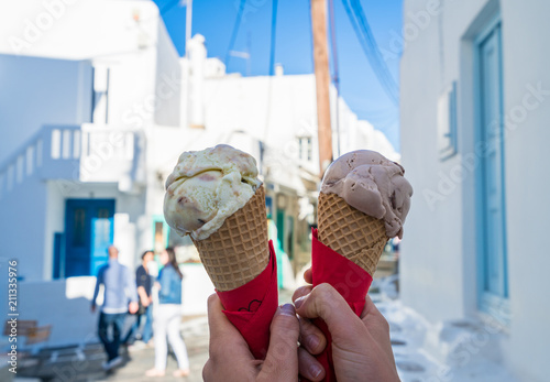 Fototapeta Naklejka Na Ścianę i Meble -  Two ice creams on blurry background in Mykonos, Greece
