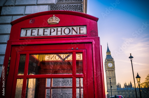 Red telephone box at sunrise in London,England
