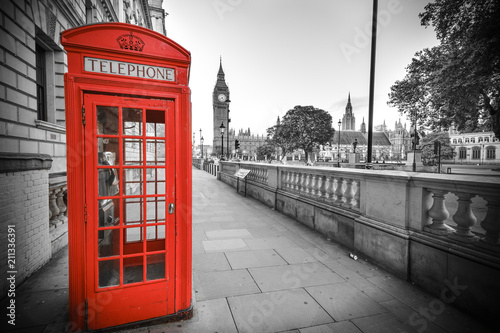 Traditional red phone box in London with the Big Ben in the background