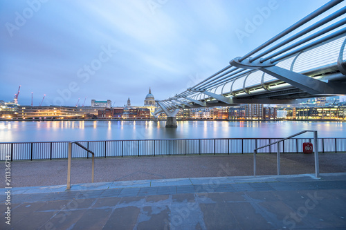 Millennium bridge and St.Paul's cathedral viewed at sunrise in London, England
