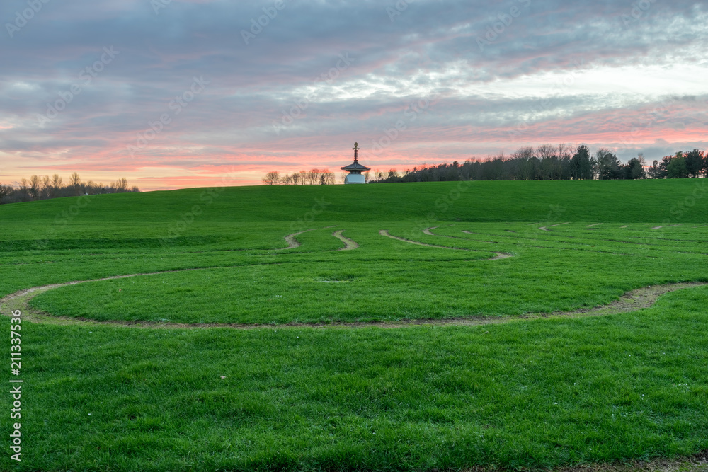 Willen Park with Peace Pagoda in the background at sunset. Milton Keynes, England