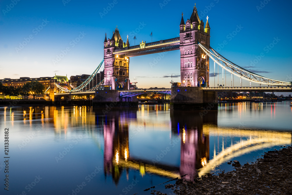 Tower Bridge illuminated at dawn. London, England