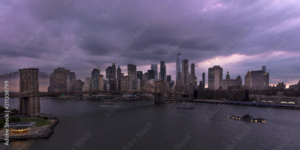 JUNE 2, 2018 - NEW YORK, NEW YORK, USA  - New York City and East River shows Brooklyn Bridge and Manhatten Skyline  as seen from Queens