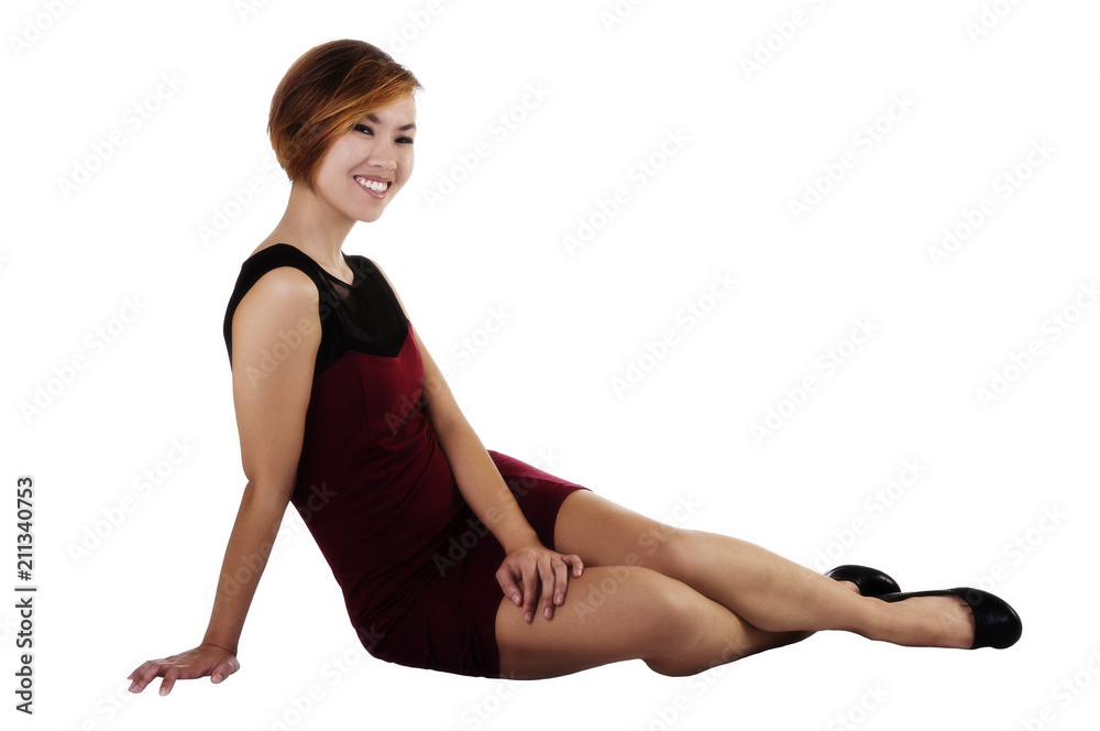 Smiling Asian American Woman Sitting In Red Dress Smiling Asian American Woman Sitting In Red Dress