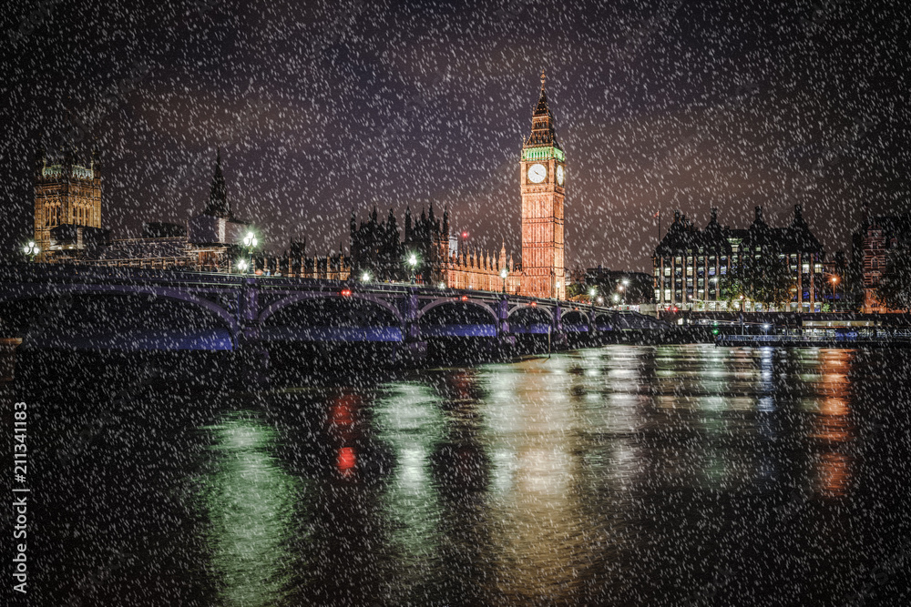 Fototapeta premium Big Ben and Westminster on a cold winter night with falling snow, London, United Kingdom