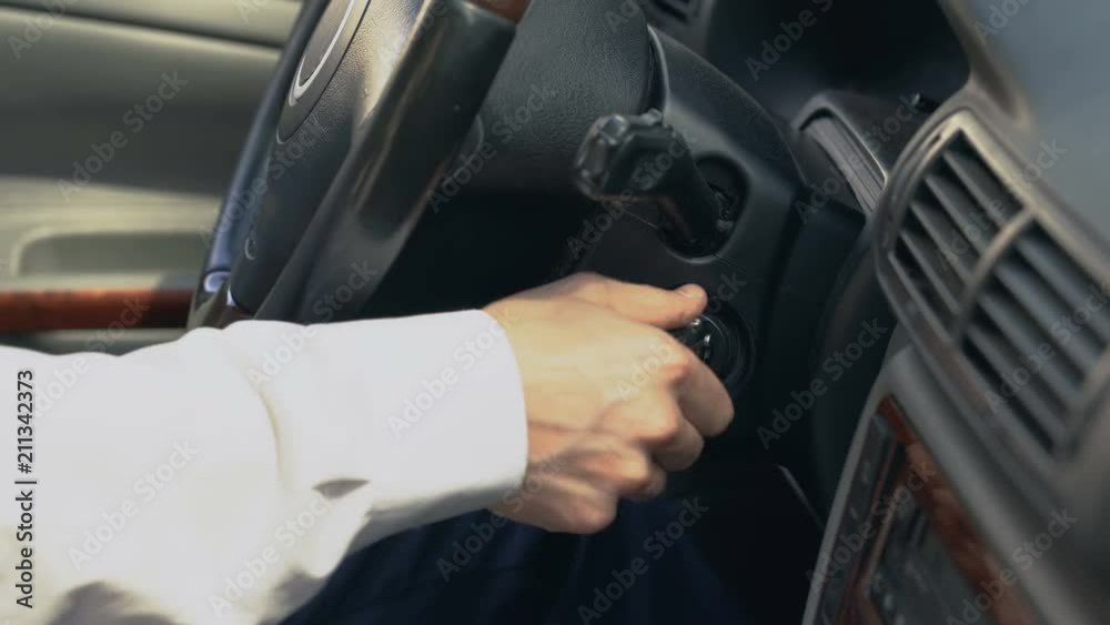 Man starting car, shifting gear, chauffeur driving for client, taxi service Man starting car, shifting gear, chauffeur driving for client, taxi service