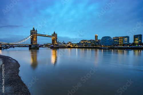 Panorama of Tower Bridge with blue sky and reflection in London. England