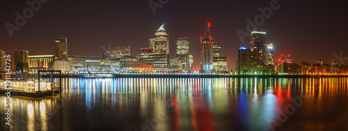 Panorama of Canary Wharf business district of London at night