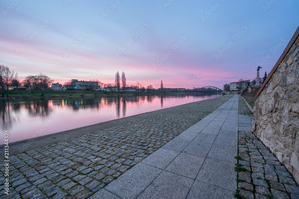View of Warta river and railway bridge at sunrise in Gorzow, Poland 