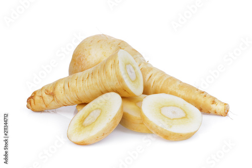 parsnip root with slices vegetable isolated on white background photo