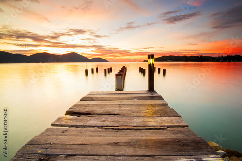 Beautiful view of sunset at Marina Island Old Jetty Malaysia. soft focus  blur due to long exposure. Visible noise due to high ISO.