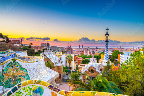View of mosaic tile and Barcelona cityscape in park Guell at sunset | Spain photo