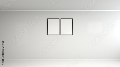 Blank white poster in black frame on the wall