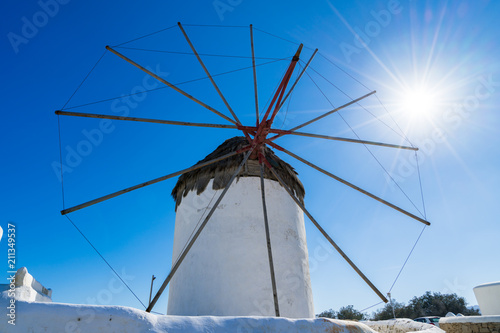 Traditional Windmill of Mykonos island with sun star, Greece