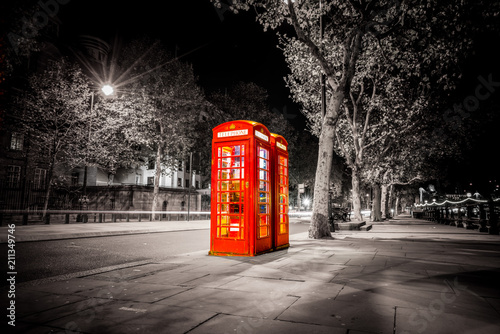 Wallpaper Mural Traditional red British telephone booth in London isolated on black and white Torontodigital.ca