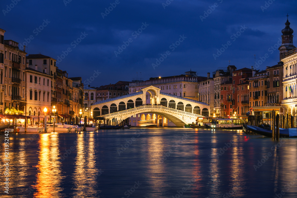 Rialto bridge and Garnd Canal at night in Venice, Italy