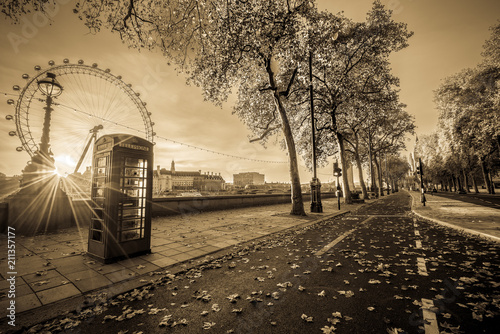 Photography Red telephone booth isolated on black and white street