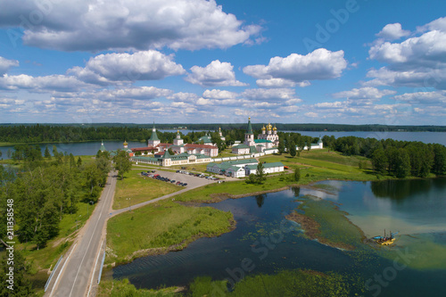 View from height on Valdaisky Iversky Bogoroditsky Svyatoozersky monastery in the sunny June afternoon (aerial photograph). Valdai, Russia