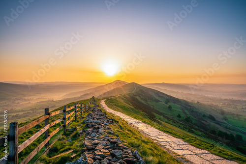 Canvas Print Stone footpath and wooden fence leading a long The Great Ridge in the English Pe
