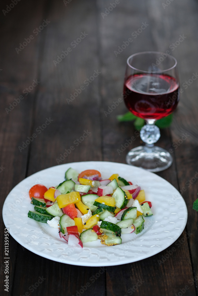  serving of salad from vegetables on old wooden table