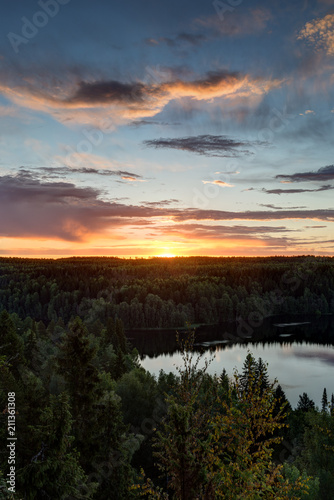 Scenic and beautiful view of a lake  forest and sky from the Aulanko lookout tower in H  meenlinna  Finland  in the summer at sunrise. Copy space.