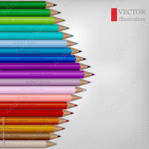 Arrow shape of rainbow colored pencils on white background.