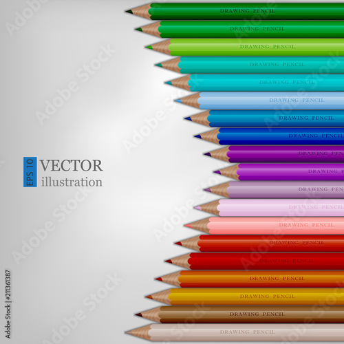 Arrow shape of rainbow colored pencils on white background. photo
