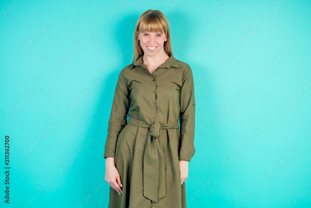 blonde woman in studio on blue background blonde woman in studio on blue background