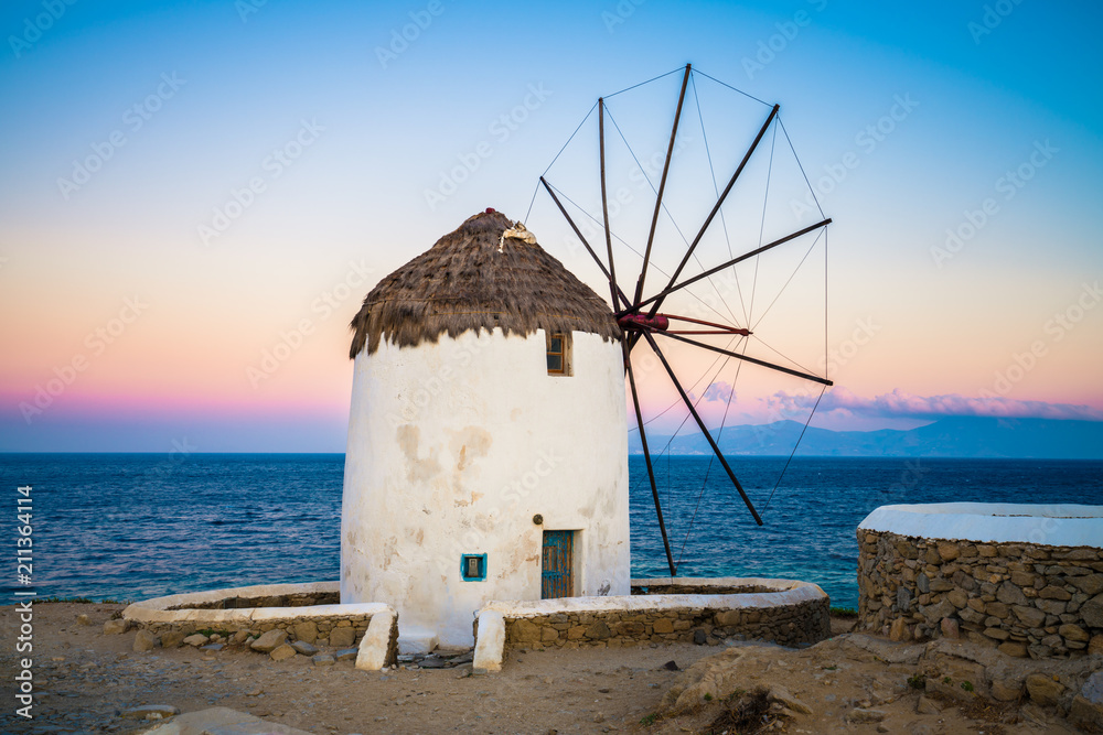Fototapeta premium Mykonos windmill with sunrise sky,Greece