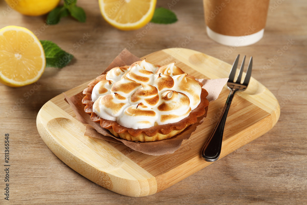 Lemon cakes with meringue on the board Lemon cakes with meringue on the board