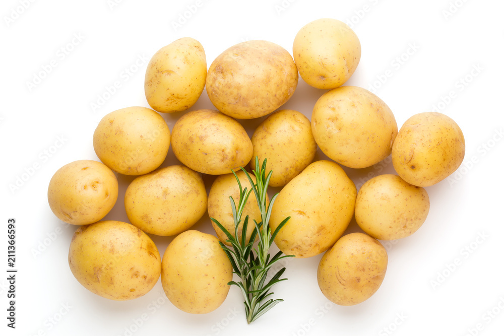 New potato and rosemarin isolated on white background close up. New potato and rosemarin isolated on white background close up.