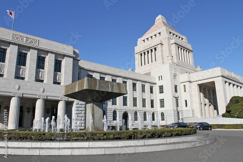 Canvas Print The unique, classic granite central tower of the National Diet Building of Japan, the meeting place of the national government, rises into a blue sky in Tokyo