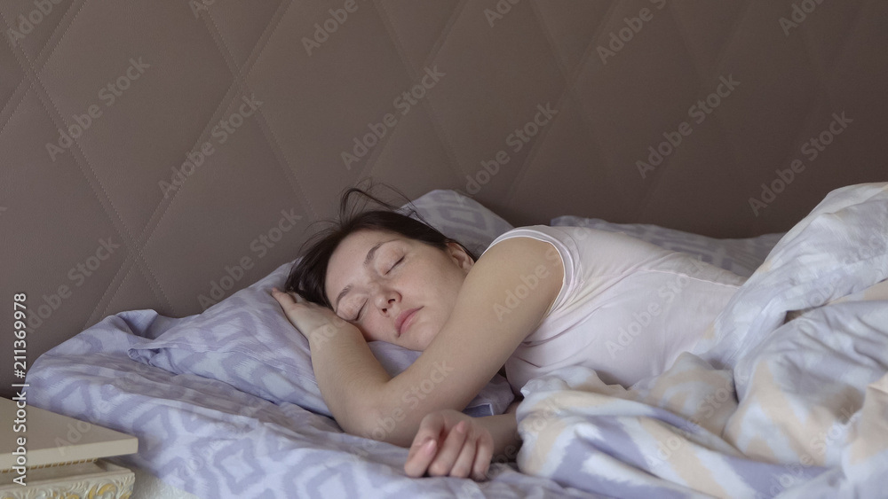 Beautiful woman who does not sleep wakes up in bed Beautiful woman who does not sleep wakes up in bed