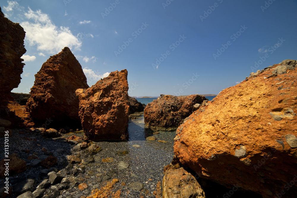 Beach with red rocks