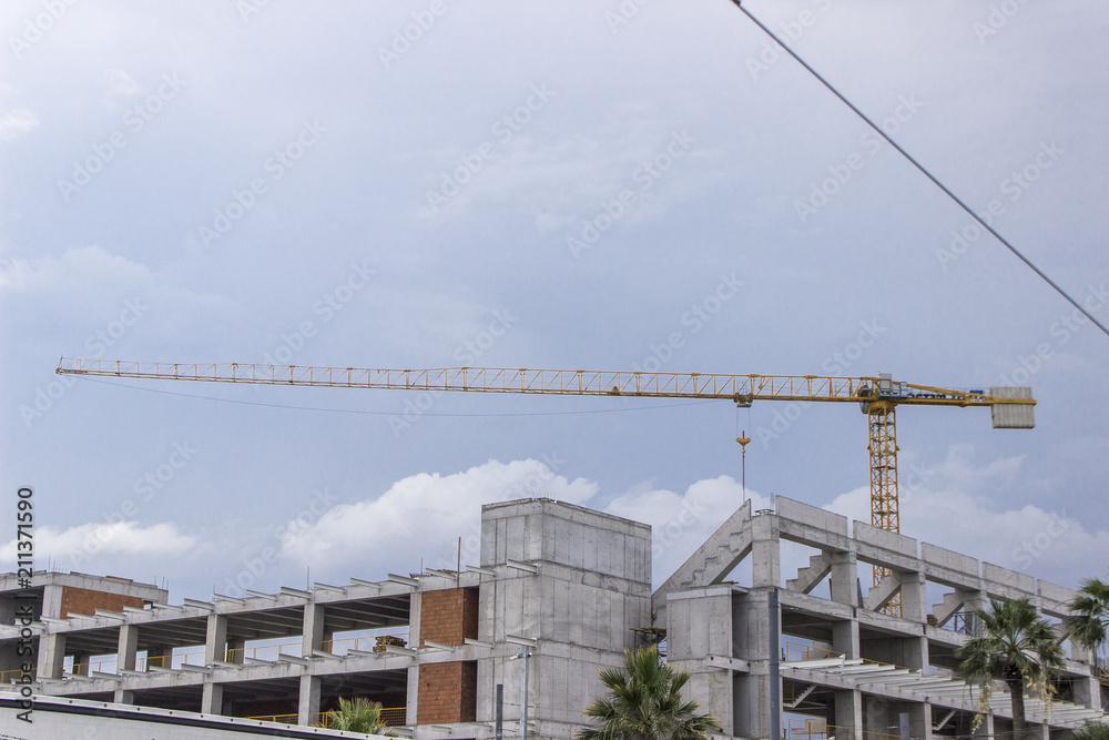 Perspective corner shot of reinforced construction site of soccer stadium with over cast sky in Izmir at Turkey