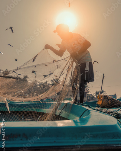 Print op canvas Silhouette of a fisherman in Sri Lanka