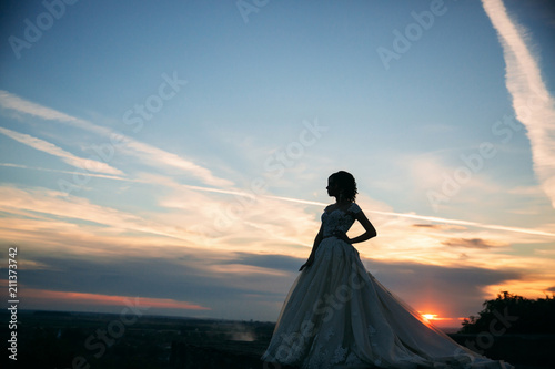 Silhouette of girl in wedding dress