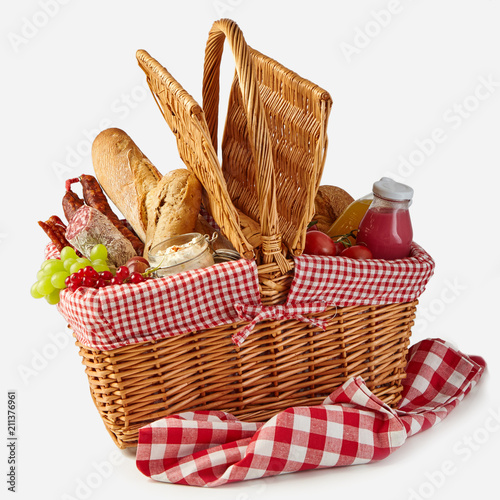 Summer picnic basket filled with food photo