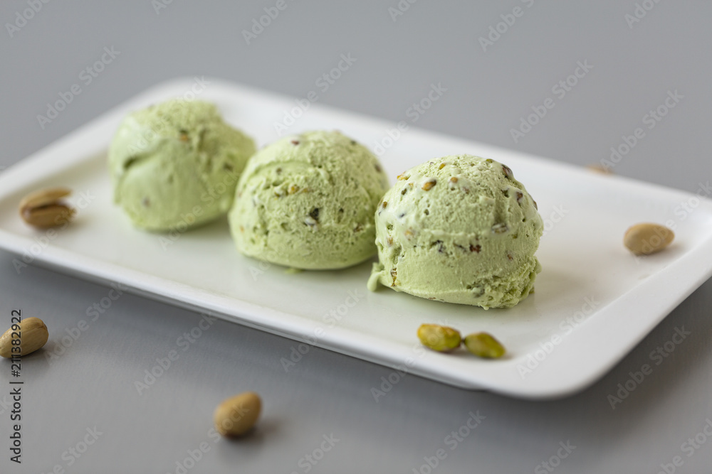 Fresh pistachio ice cream, nuts and mint. Fresh pistachio ice cream, nuts and mint.