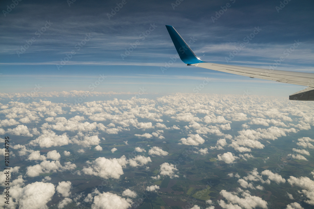 Aerial view of sky from aircraft window. Aerial view of sky from aircraft window.