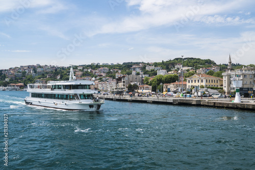 Beautiful View of Bosphorus Coastline in Istanbul with Exquisite wooden Houses and Boat © Oleksandr