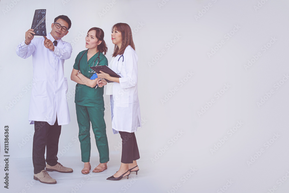 doctor and nurse checking patient information on a tablet device doctor and nurse checking patient information on a tablet device