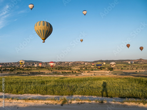 Shade of a Man and Hot Air Balloons on Background in Cappadocia, Turkey.