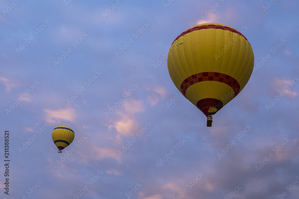 Fototapeta premium Two Yellow Hot Air Ballons in the Sky