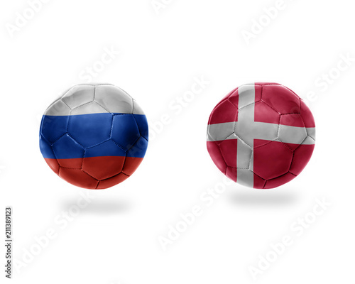 football balls with national flags of denmark and russia.