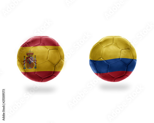 football balls with national flags of colombia and spain.